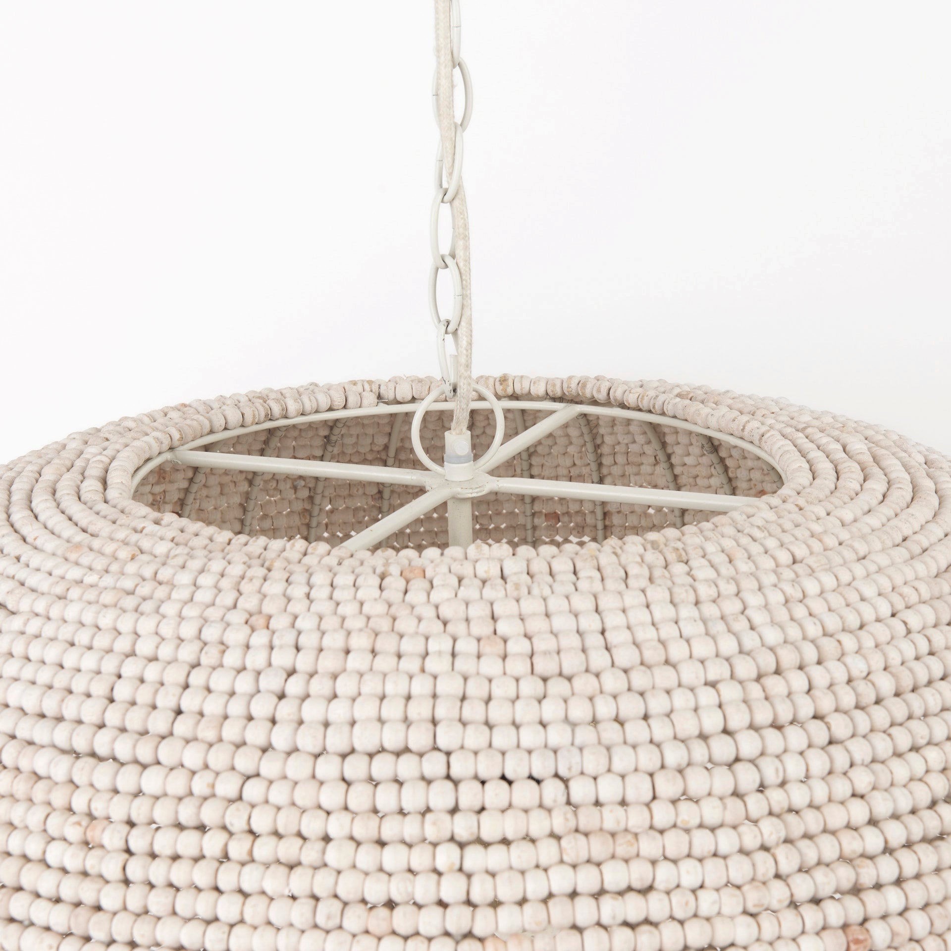 Theta White-Washed Beaded Chandelier viewed from the side.