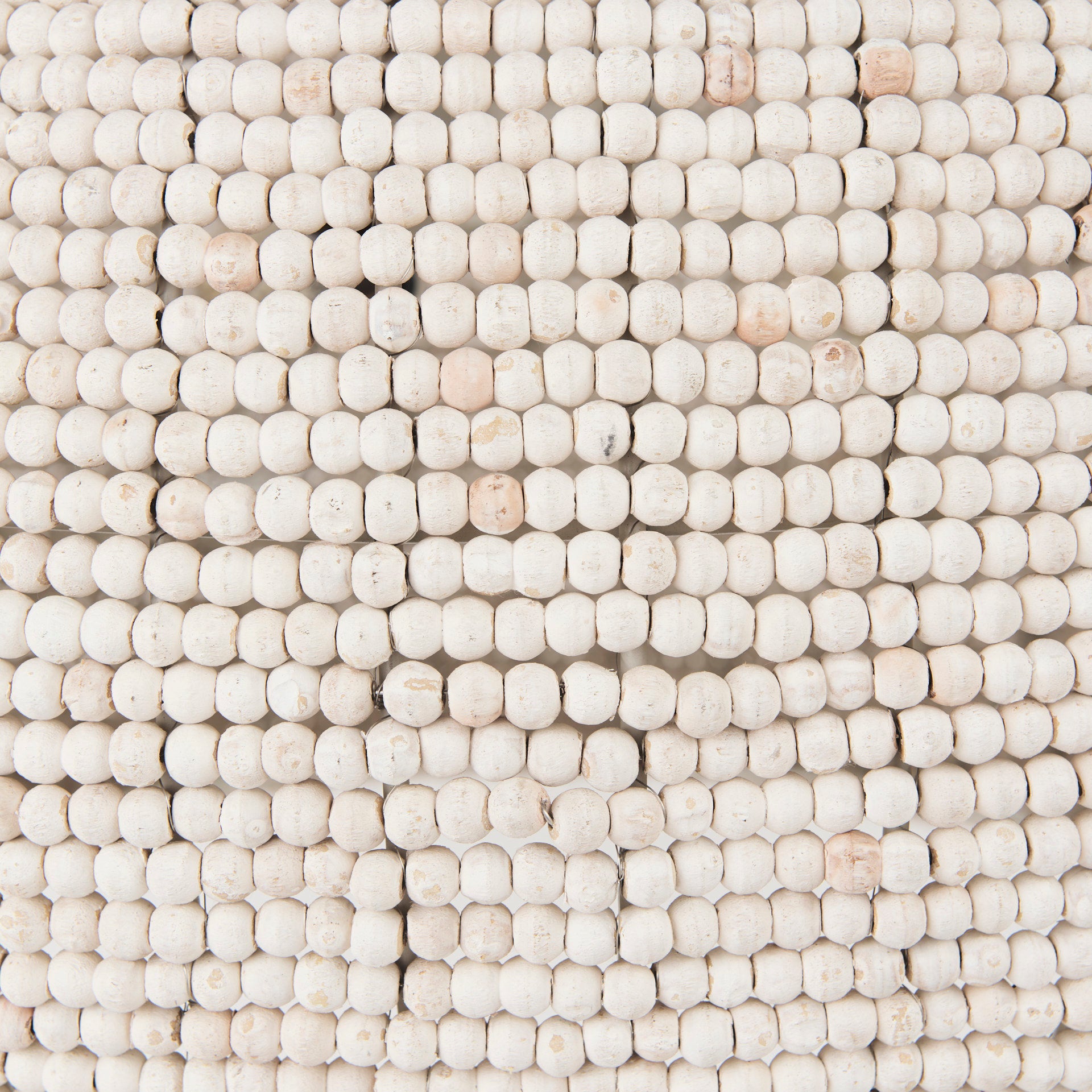Theta White-Washed Beaded Chandelier shown from a different angle to reveal its silhouette.