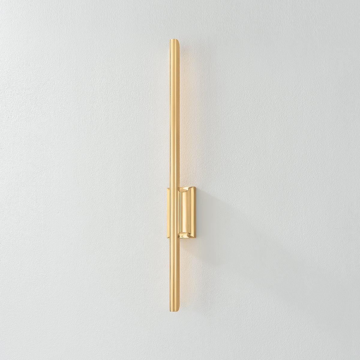 Close-up of the Bernard Wall Sconce in aged brass showing the arm curve and shade silhouette.