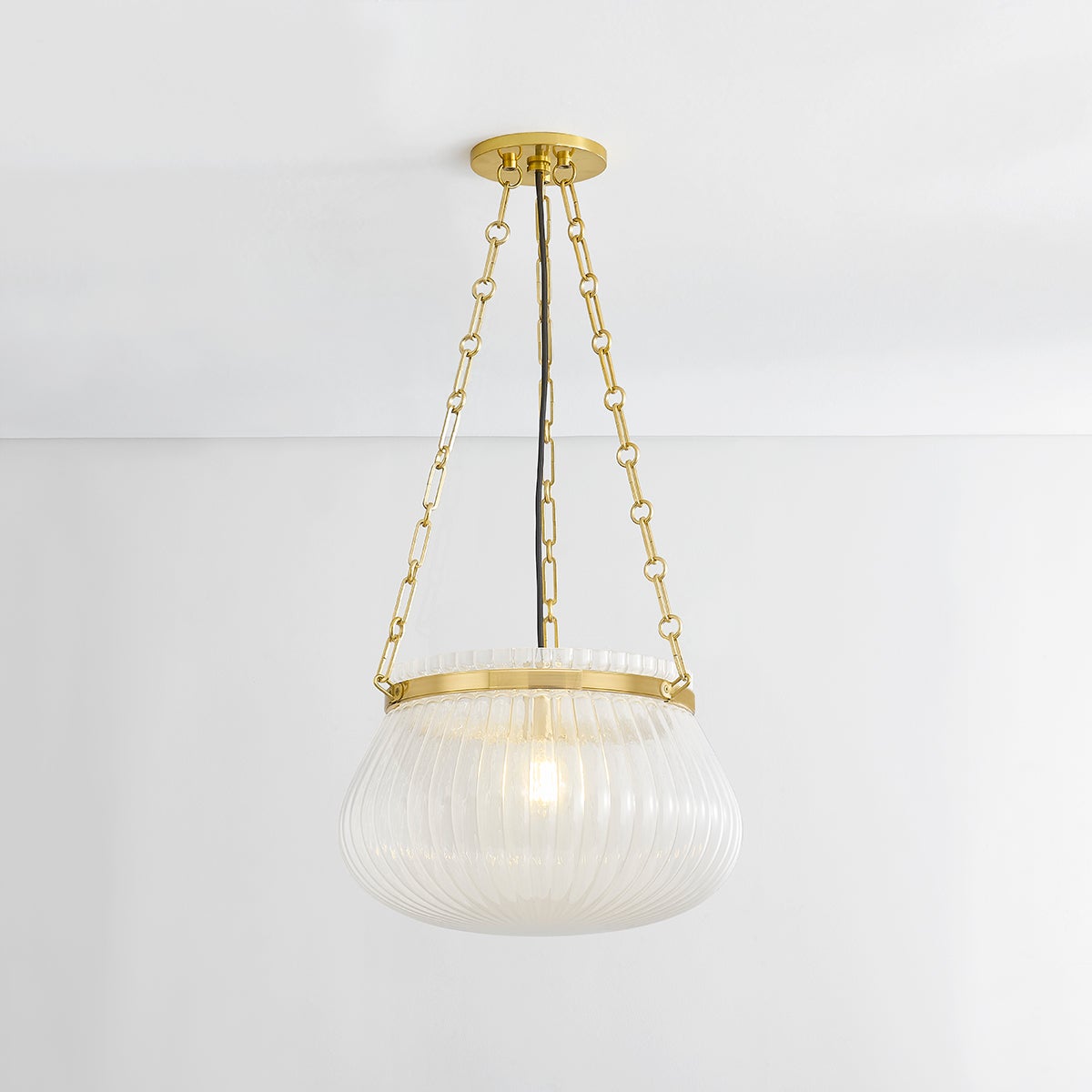 Granby Pendant 17" in aged brass shown from the front to reveal the shade shape and metal detail.