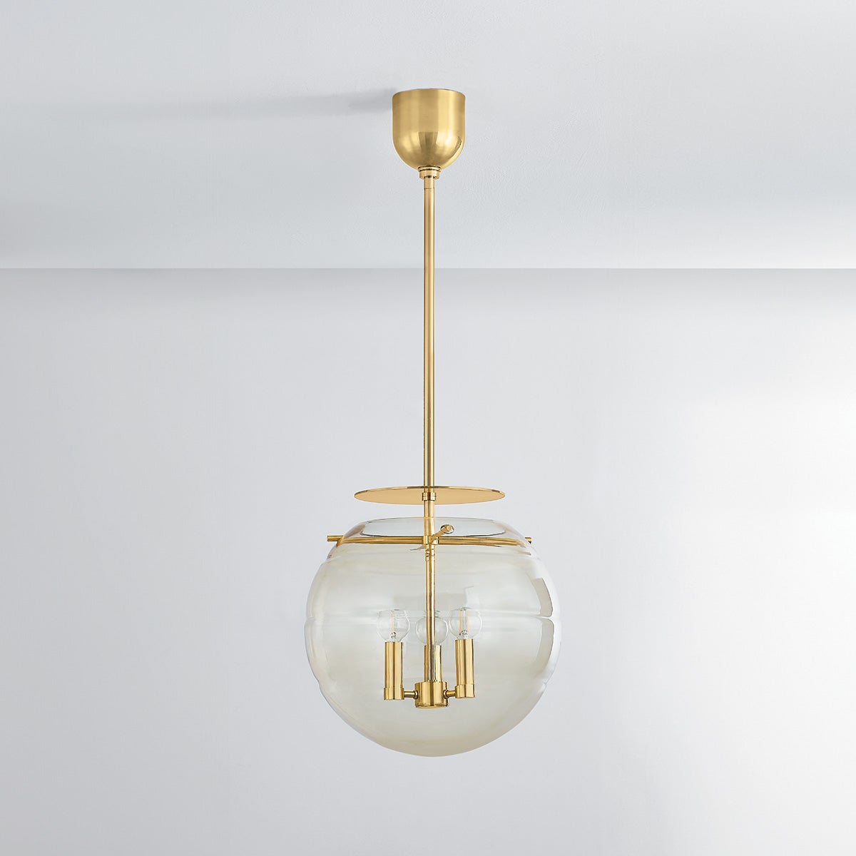 Gill Pendant 15" in aged brass shown from a second angle to highlight the shade shape and metal detail.