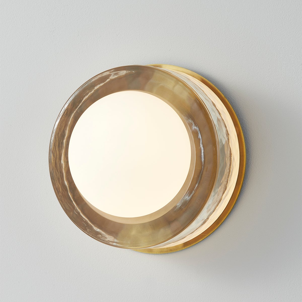 Close-up of the Mackay Wall Sconce 7.75" x 0" in aged brass showing the arm curve and shade silhouette.