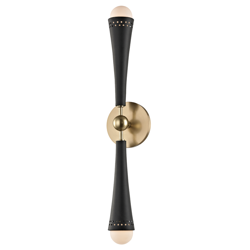 Tupelo Wall Sconce in aged brass shown from the front to reveal the arm curve and shade silhouette.