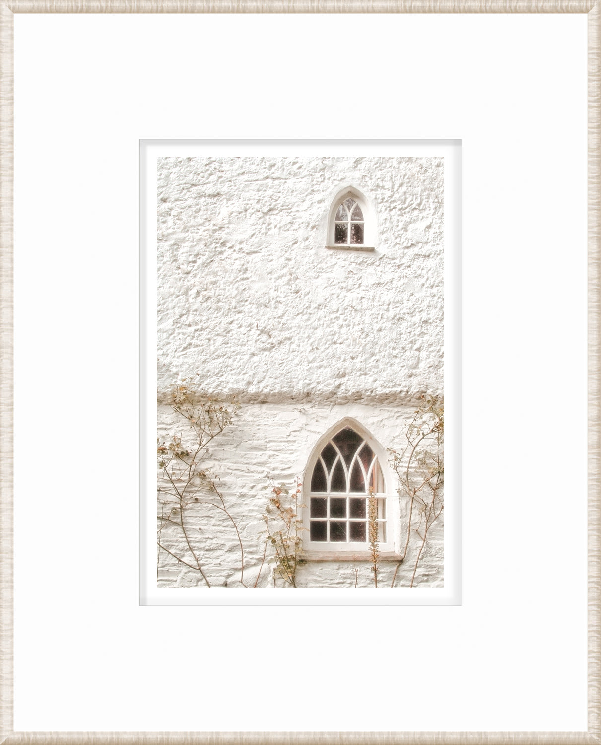 Masonry – Arched Windows wall art showcasing two arched windows on a white textured wall.