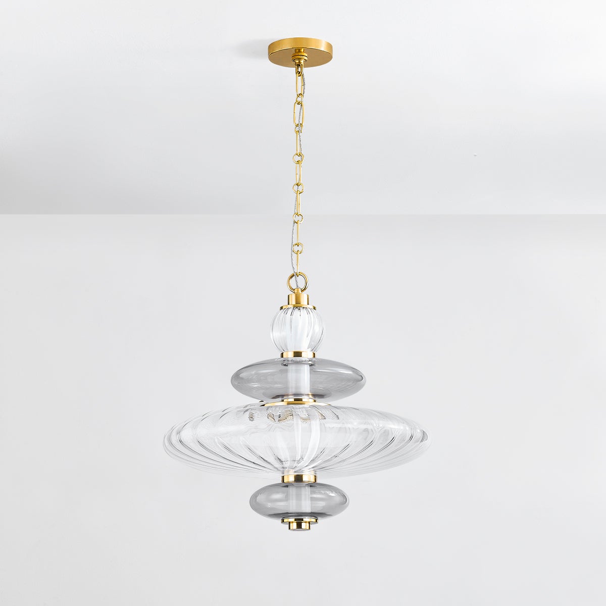 Williams Pendant 19" in aged brass shown from a second angle to highlight the shade shape and metal detail.