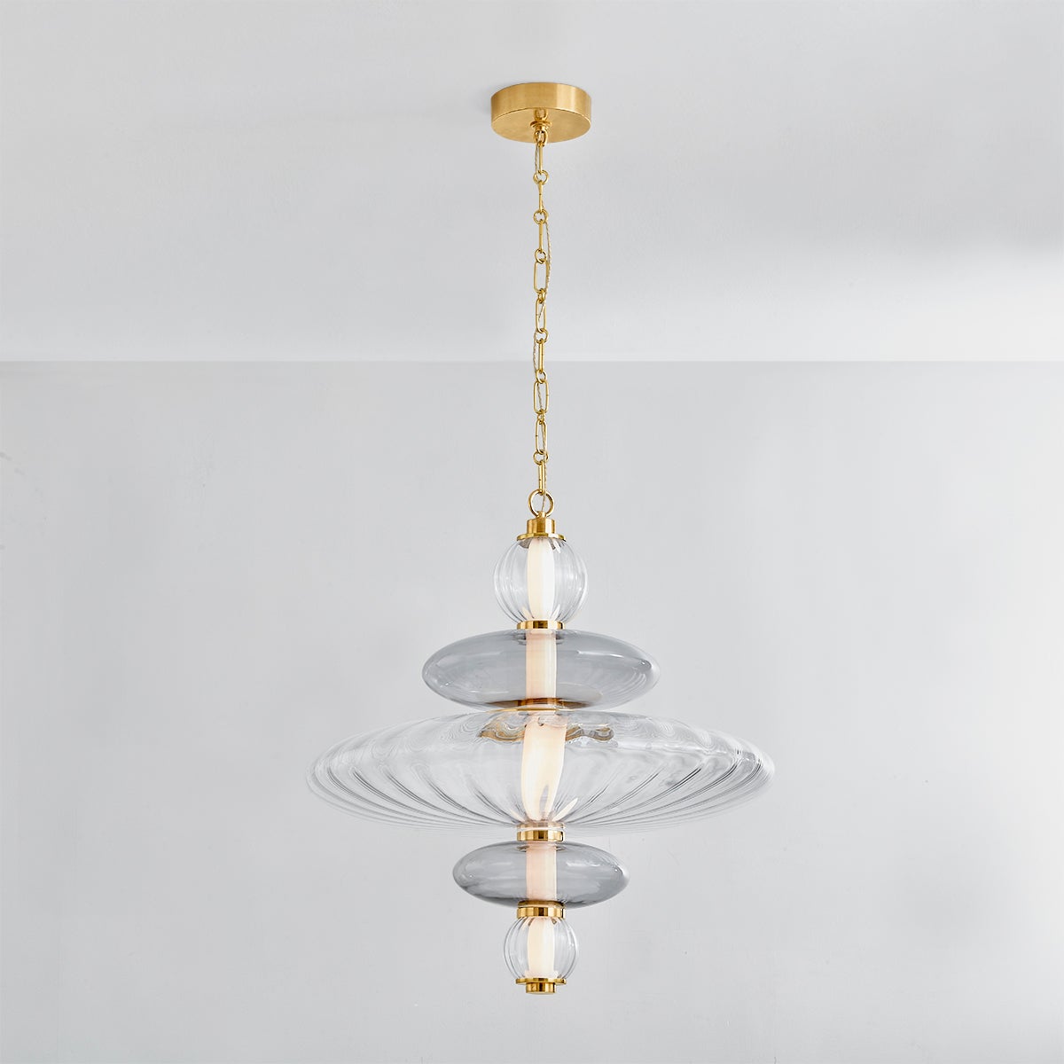 Close-up of the Williams Pendant 24.75" in aged brass showing the shade shape and metal detail.