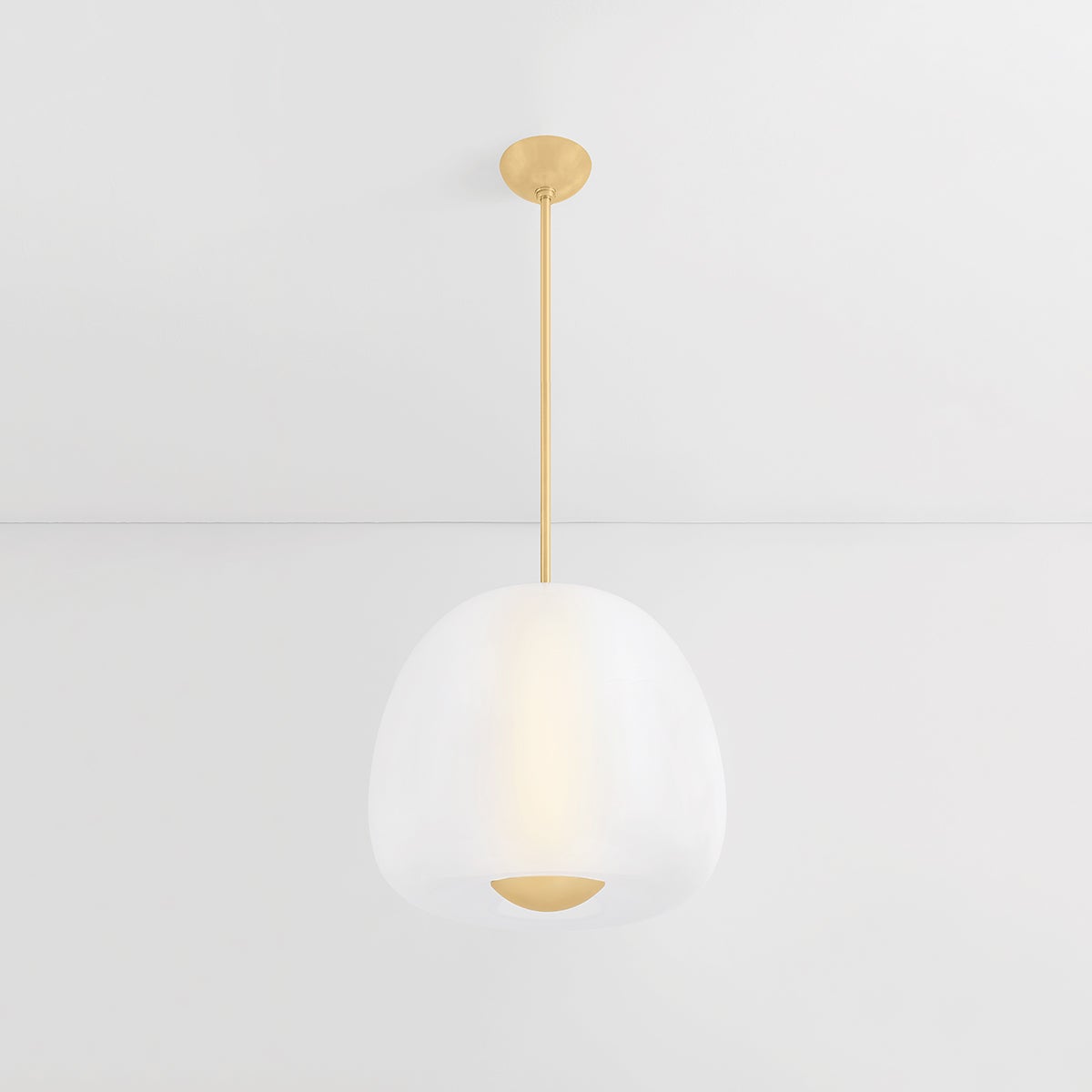 Close-up of the Scranton Pendant 19" in aged brass showing the shade shape and metal detail.