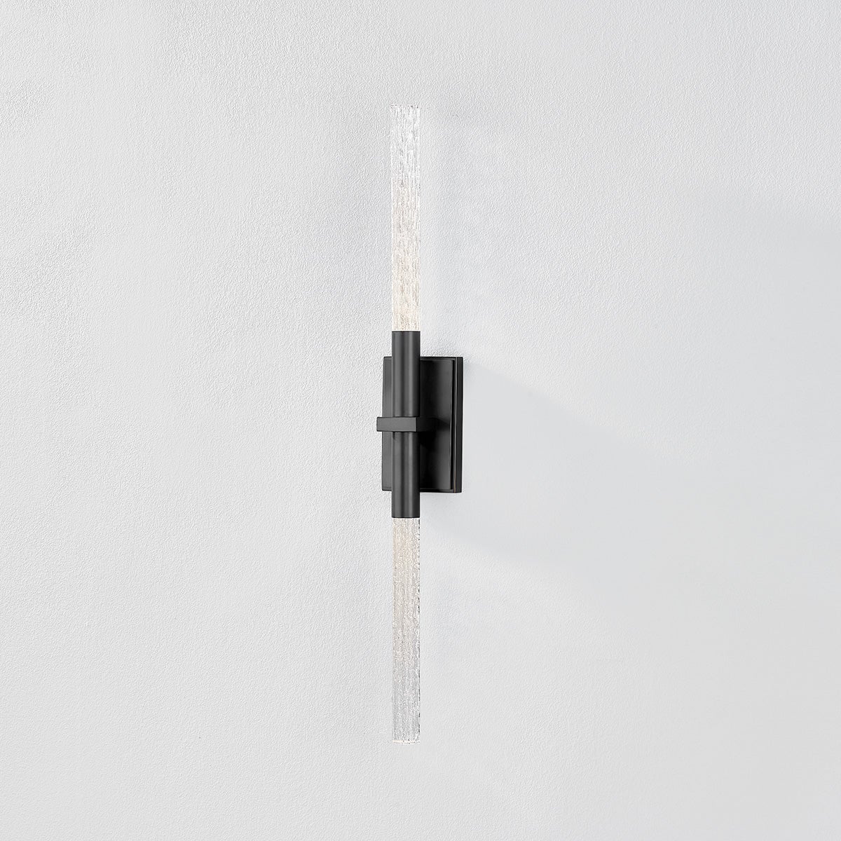 Close-up of the Millerton Wall Sconce showing the arm curve and shade silhouette.