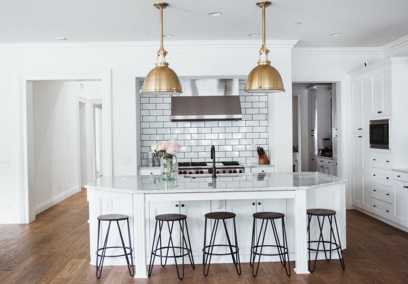 Close-up of the Massena Pendant 19.5" in aged brass showing the shade shape and metal detail.
