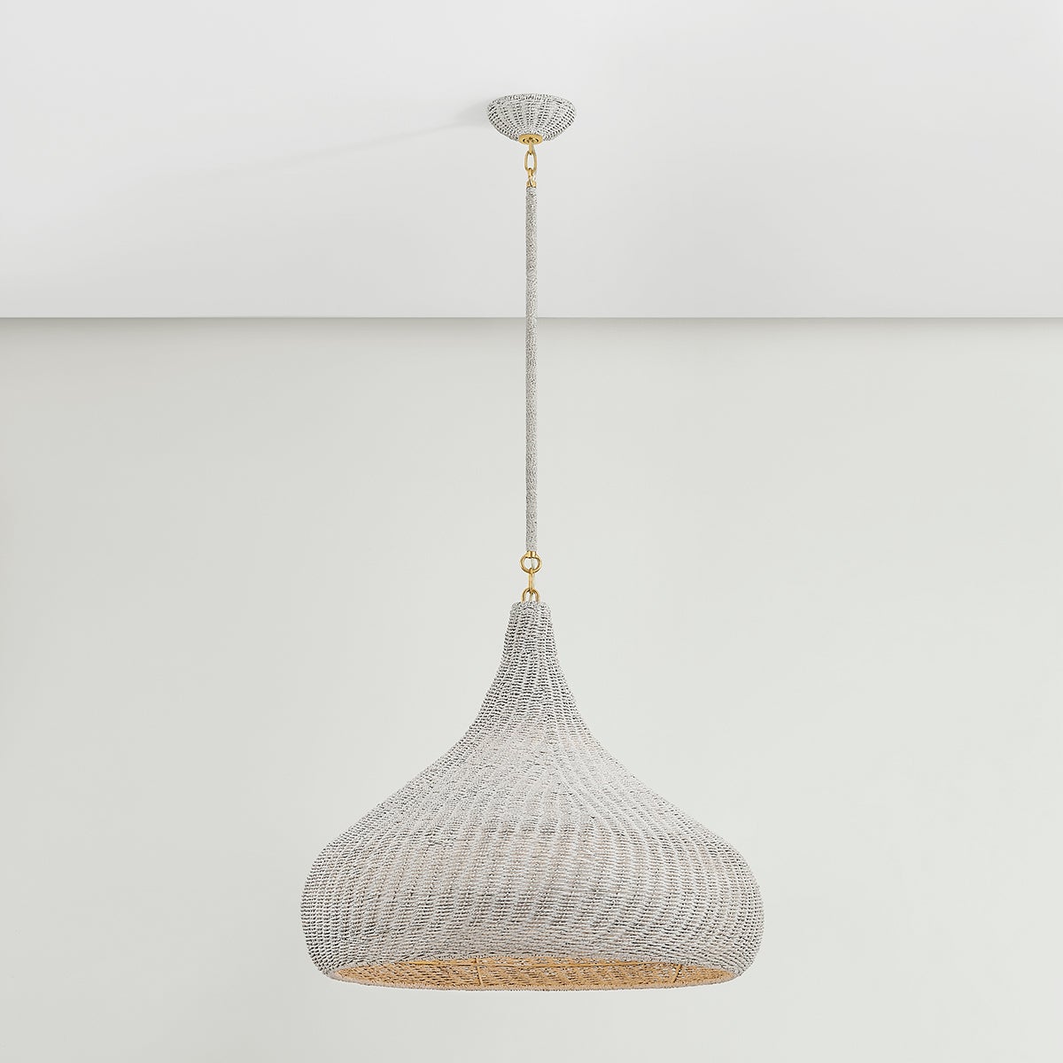 Close-up of the Hampstead Pendant 28" in aged brass showing the shade shape and metal detail.