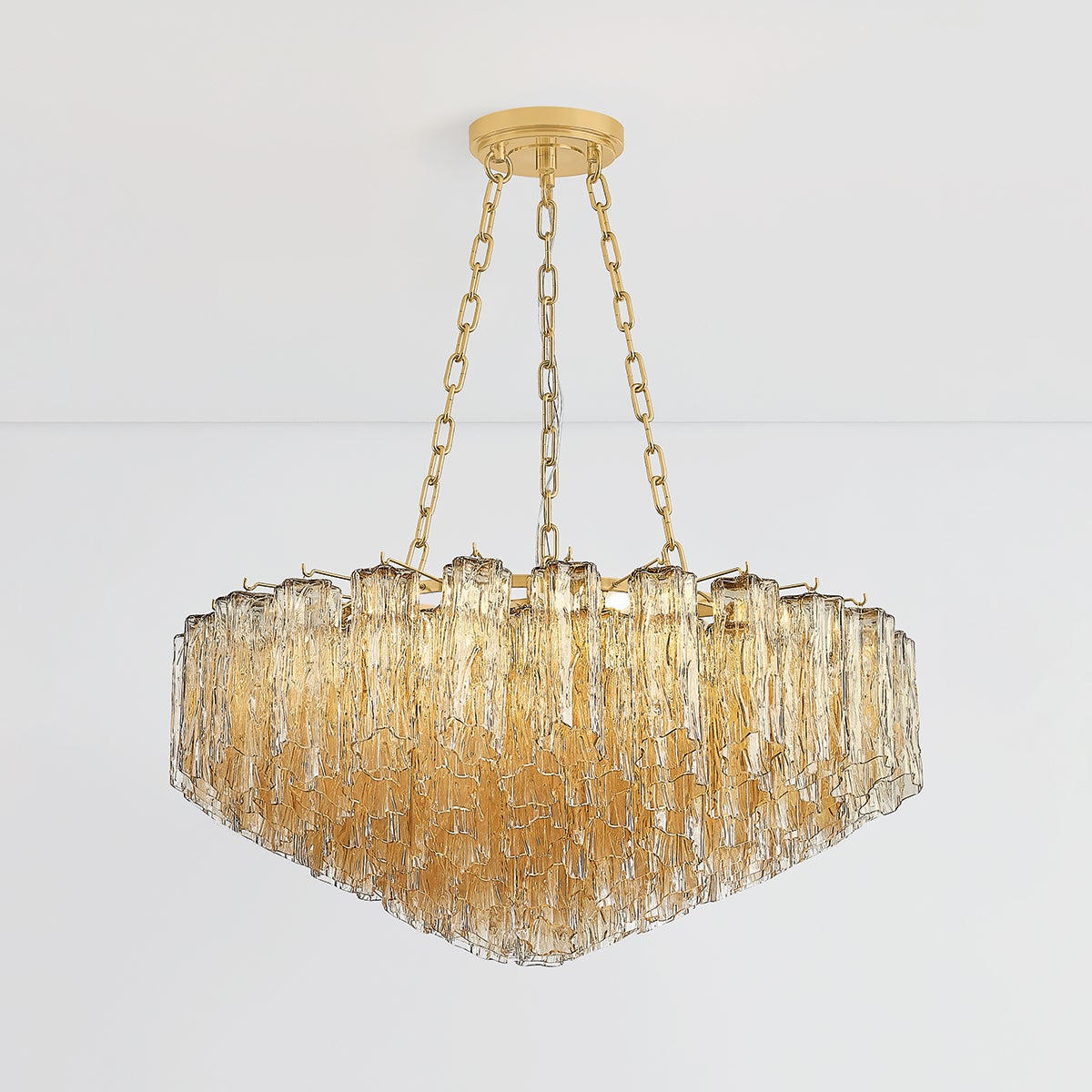 Close-up of the Watertown Chandelier 33" in aged brass showing the frame, arms, and shade detail.