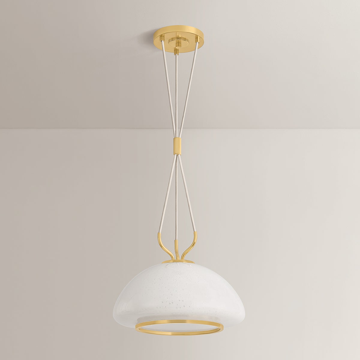 Baudette Pendant 14.25" in aged brass shown from a second angle to highlight the shade shape and metal detail.