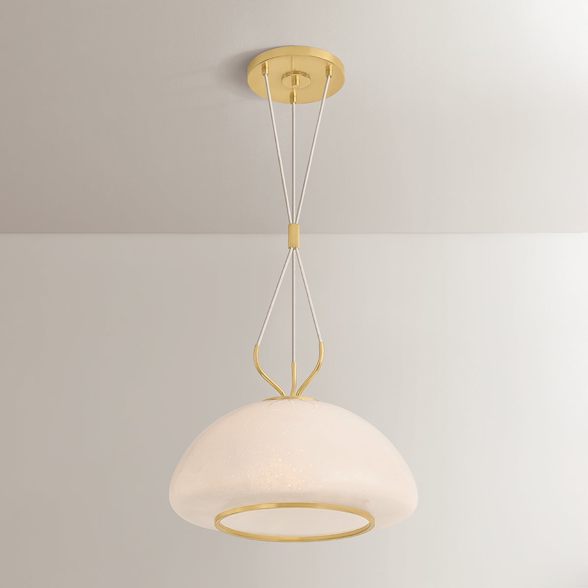 Close-up of the Baudette Pendant 18" in aged brass showing the shade shape and metal detail.