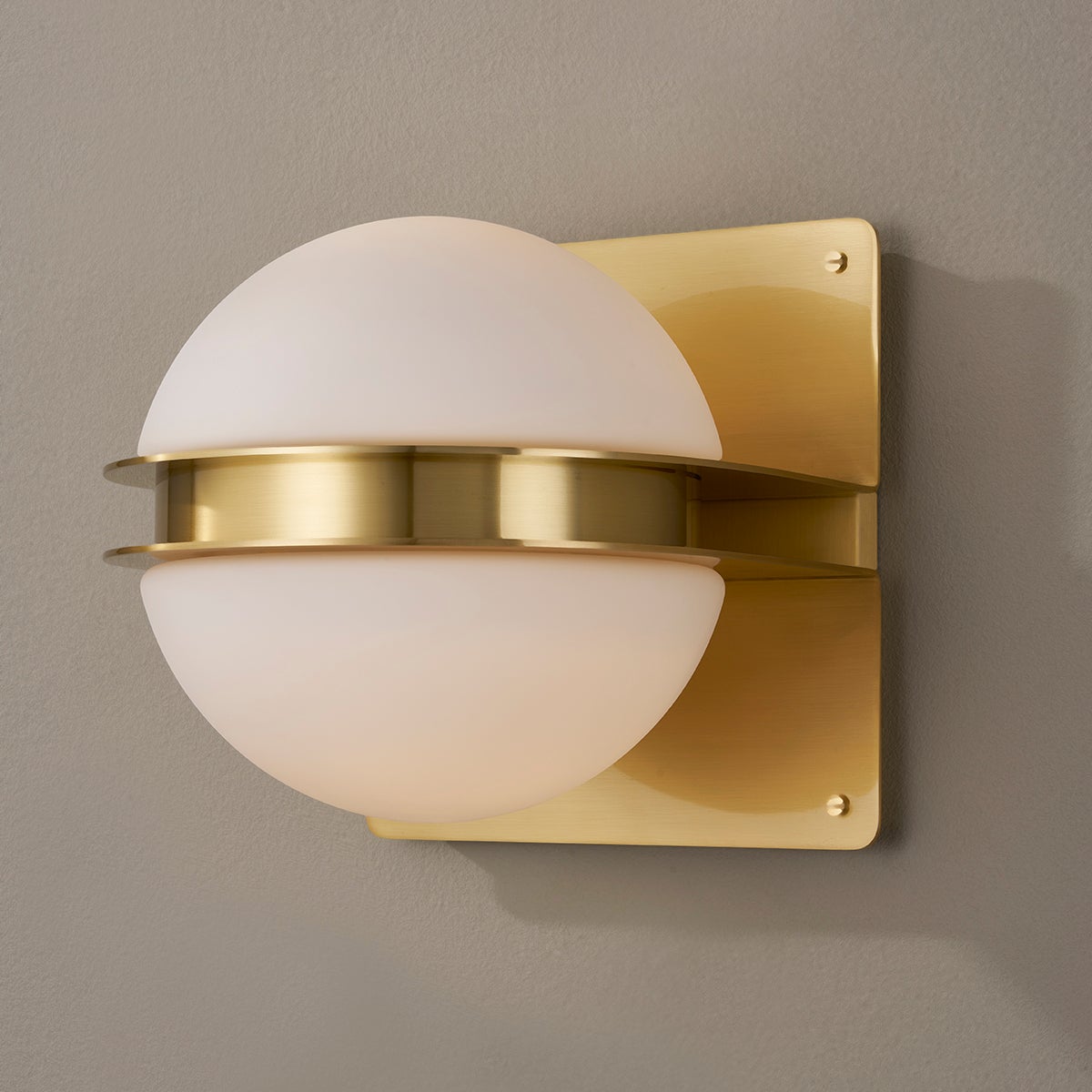 Rudolf Wall Sconce in aged brass shown from a second angle to highlight the arm curve and shade silhouette.