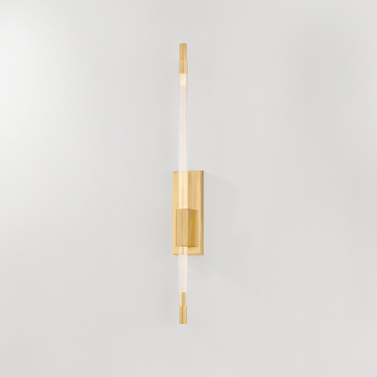 Rosco Wall Sconce in aged brass shown from the front to reveal the arm curve and shade silhouette.