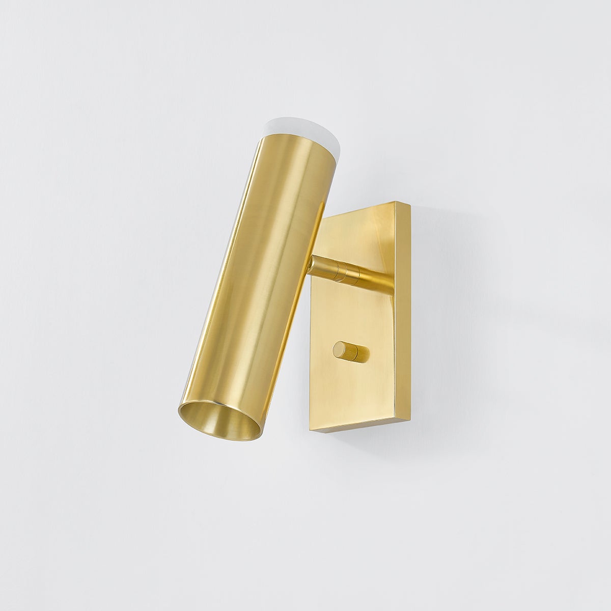Clark Wall Sconce in aged brass shown from the front to reveal the arm curve and shade silhouette.