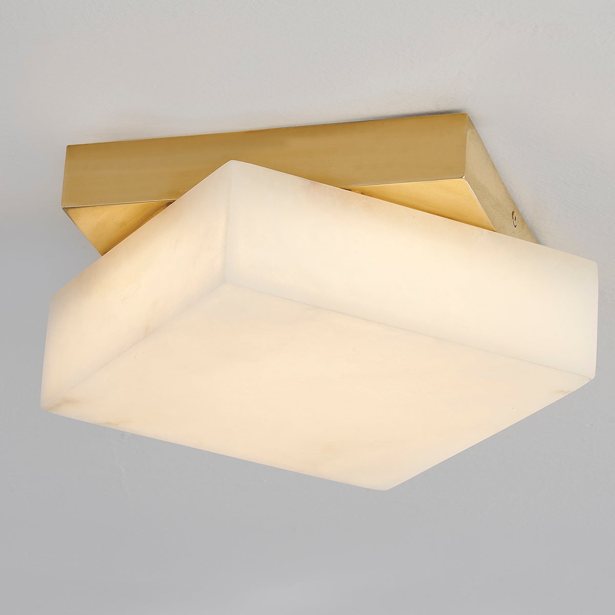 Brockton Flush Mount in aged brass shown from the front to reveal the shade profile and mounting canopy.