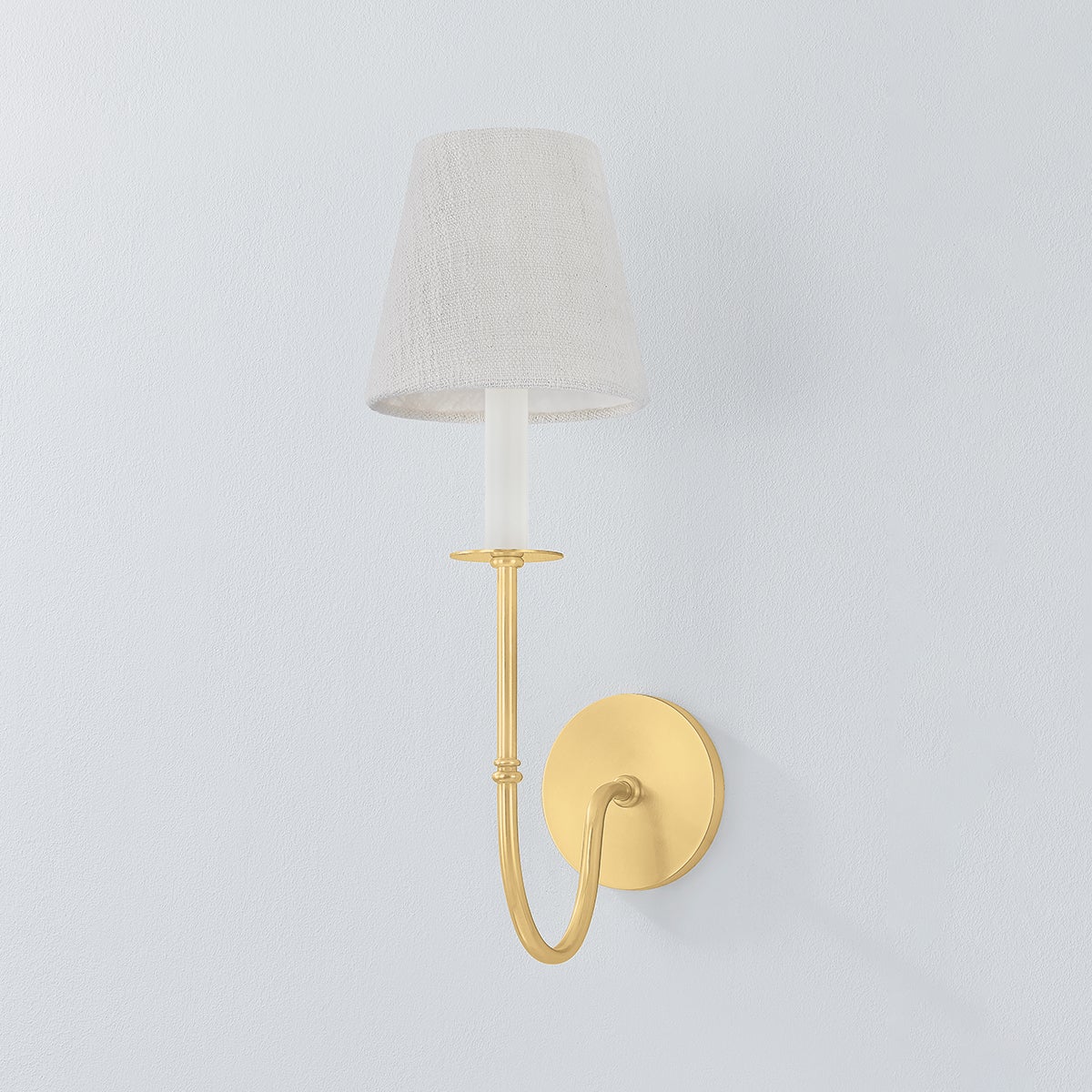 Amina Wall Sconce in aged brass shown from a second angle to highlight the arm curve and shade silhouette.