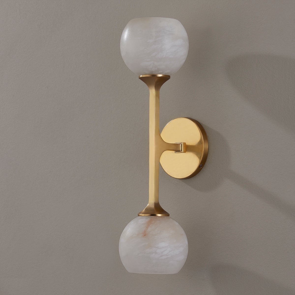 Melton Wall Sconce 2-Light 5" x 18.5" in aged brass shown from the front to reveal the arm curve and shade silhouette.