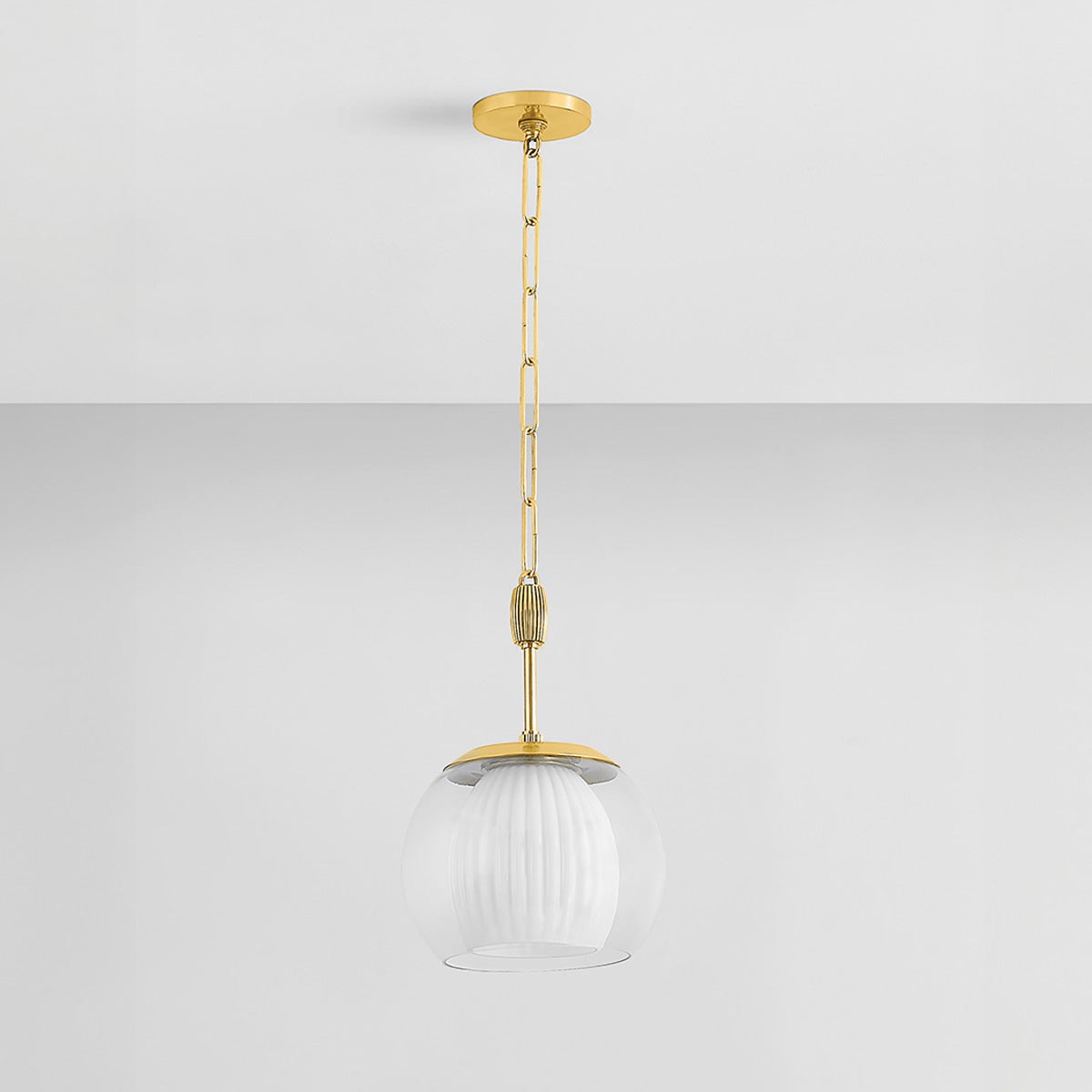 Clementon Pendant 11" in aged brass shown from the front to reveal the shade shape and metal detail.