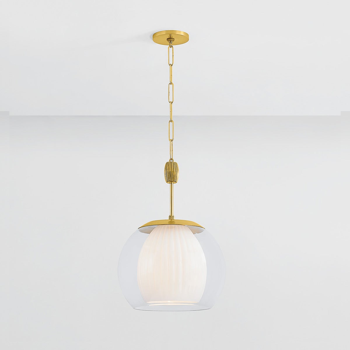 Close-up of the Clementon Pendant 17" in aged brass showing the shade shape and metal detail.
