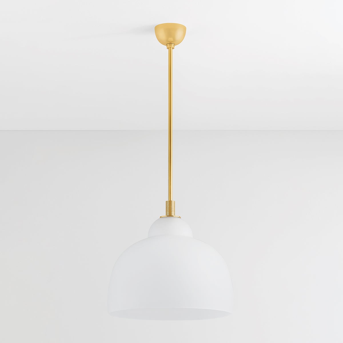 Oberon Pendant 18" in aged brass shown from a second angle to highlight the shade shape and metal detail.