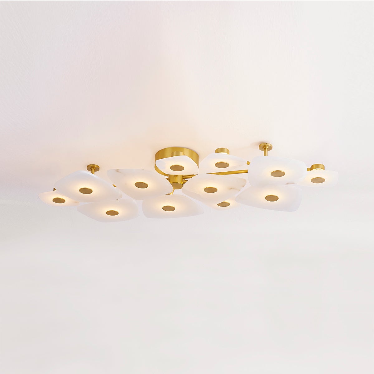 Holmdel Semi Flush 23.75" in aged brass shown from the front to reveal the shade profile and mounting canopy.