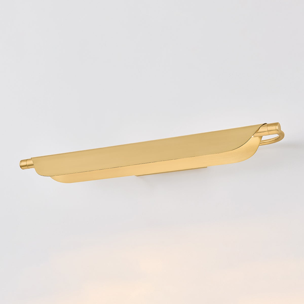 Tinwald Picture Light 27" in aged brass shown from the front to reveal the arm curve and shade proportion.