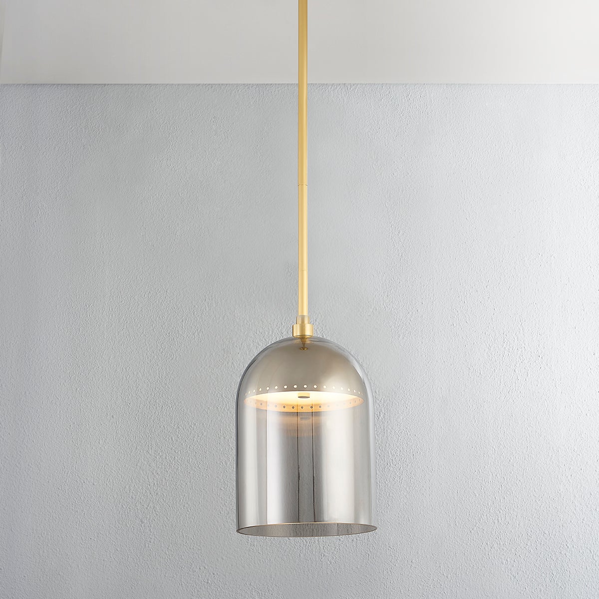 Dorval Pendant 9" in aged brass shown from the front to reveal the shade shape and metal detail.