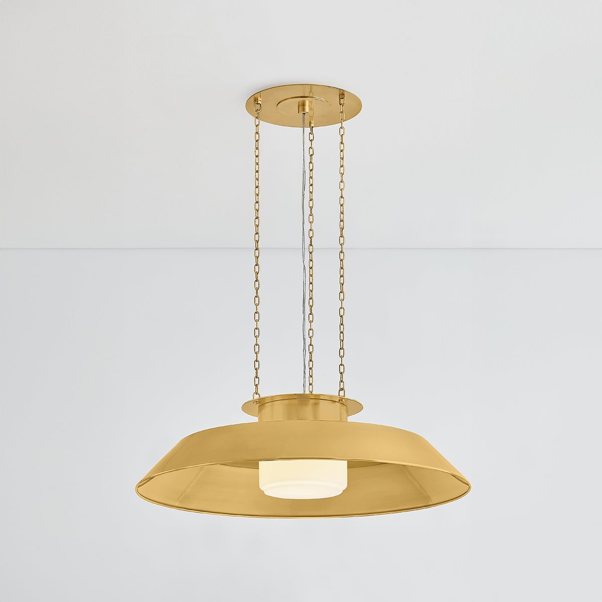 Close-up of the Woodrow Pendant 32" in aged brass showing the shade shape and metal detail.