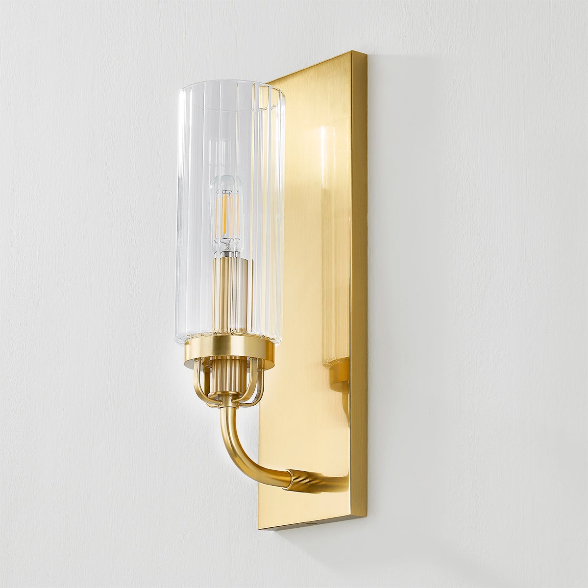 Halifax Wall Sconce in aged brass shown from a second angle to highlight the arm curve and shade silhouette.
