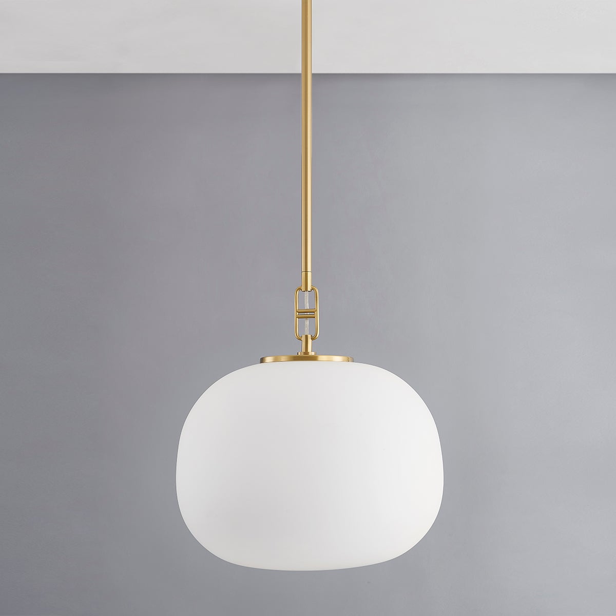 Ingels Pendant 16" in aged brass shown from a second angle to highlight the shade shape and metal detail.