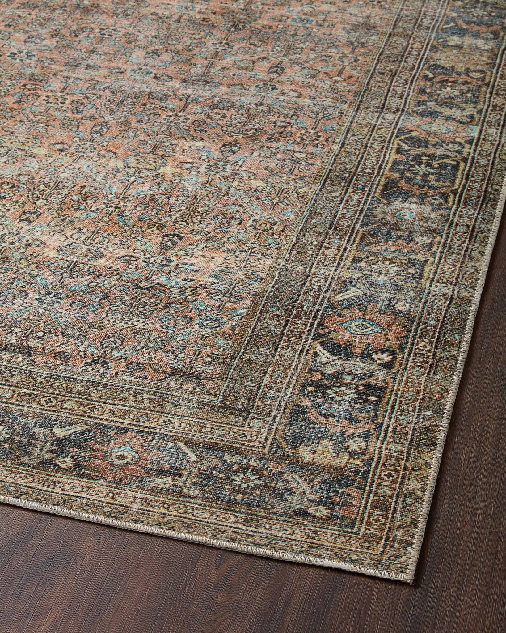 Adrian Terracotta / Multi shown in a curated living room setting at Laurie Yapp Home.
