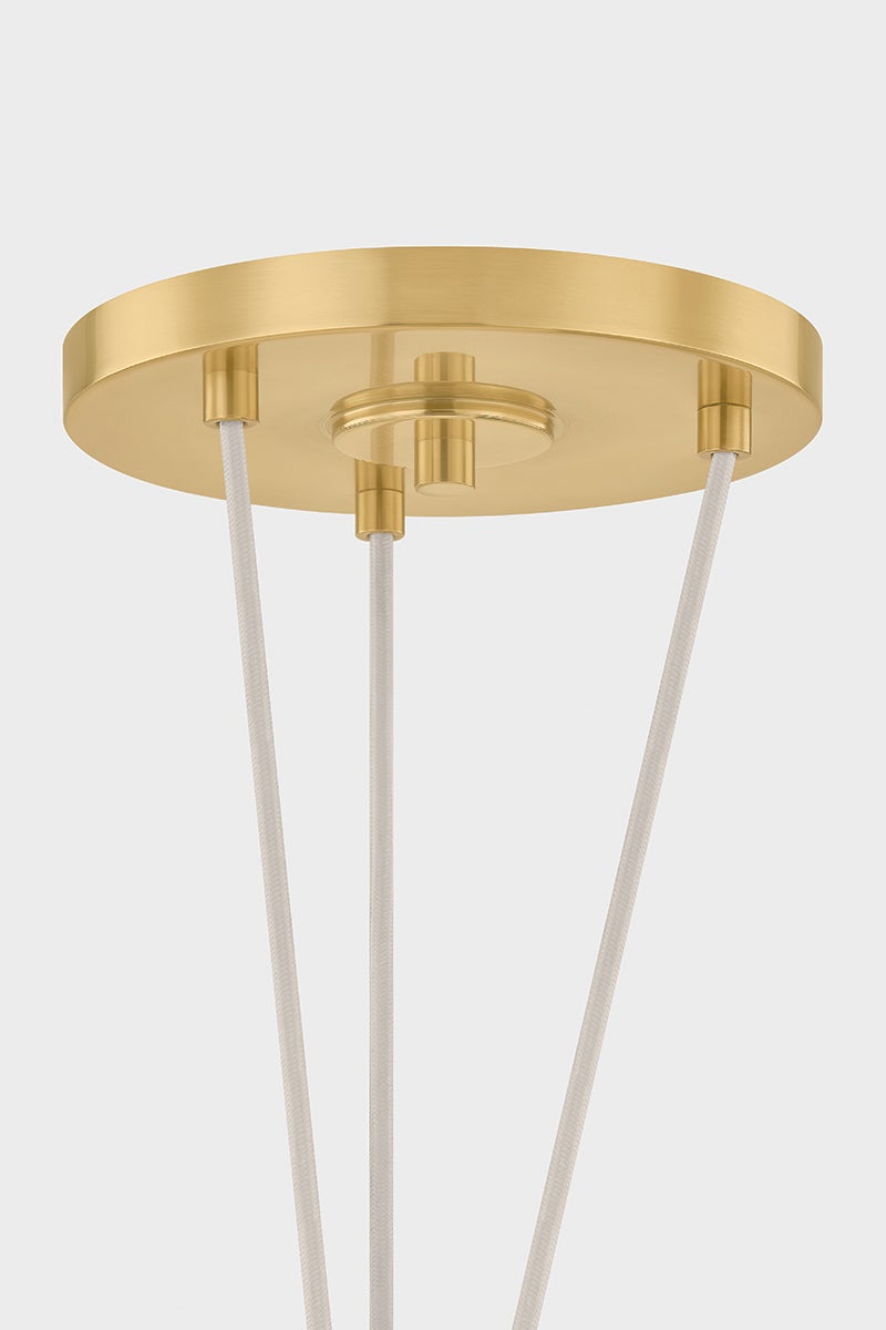 Baudette Pendant 18" in aged brass shown from a second angle to highlight the shade shape and metal detail.