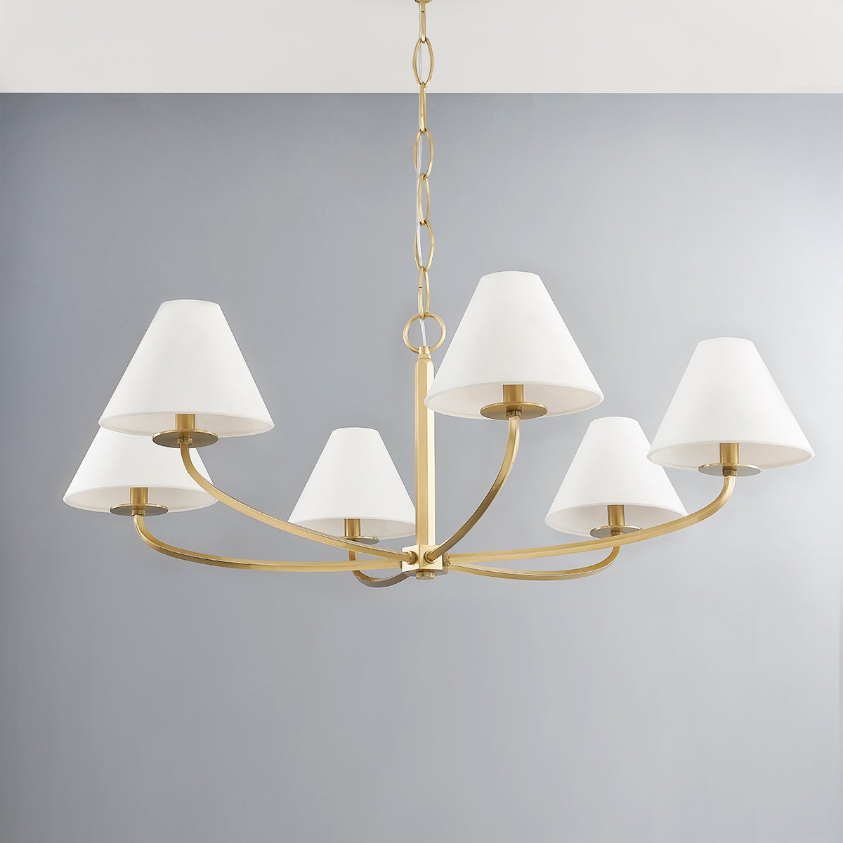 Close-up of the Stacey Chandelier 40.25" in aged brass showing the frame, arms, and shade detail.