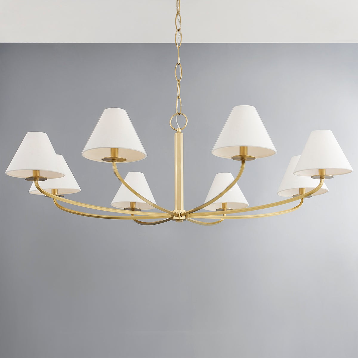 Close-up of the Stacey Chandelier 52.25" in aged brass showing the frame, arms, and shade detail.