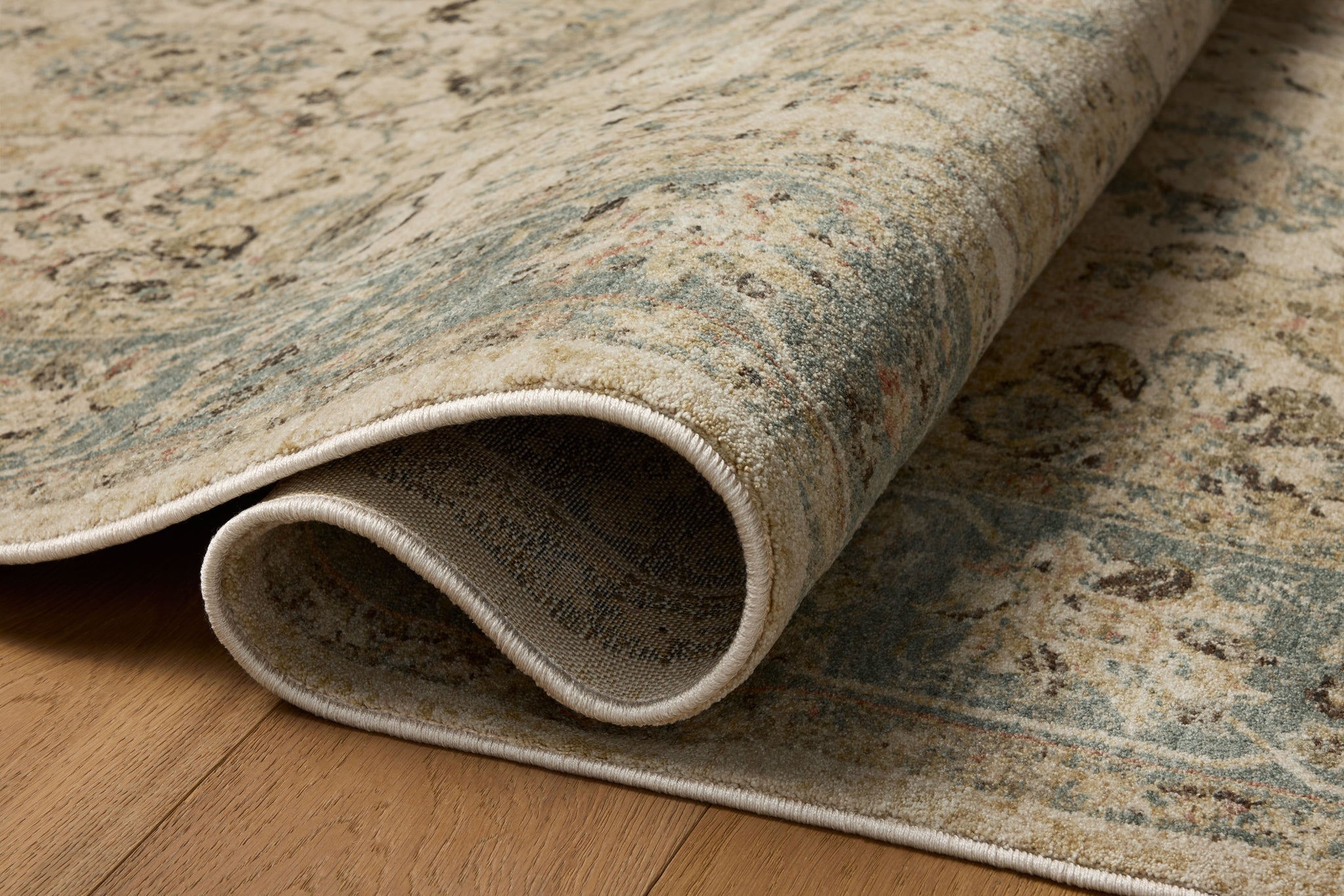 Briar Ant. Ivory / Blue shown from a different angle to reveal its pattern.