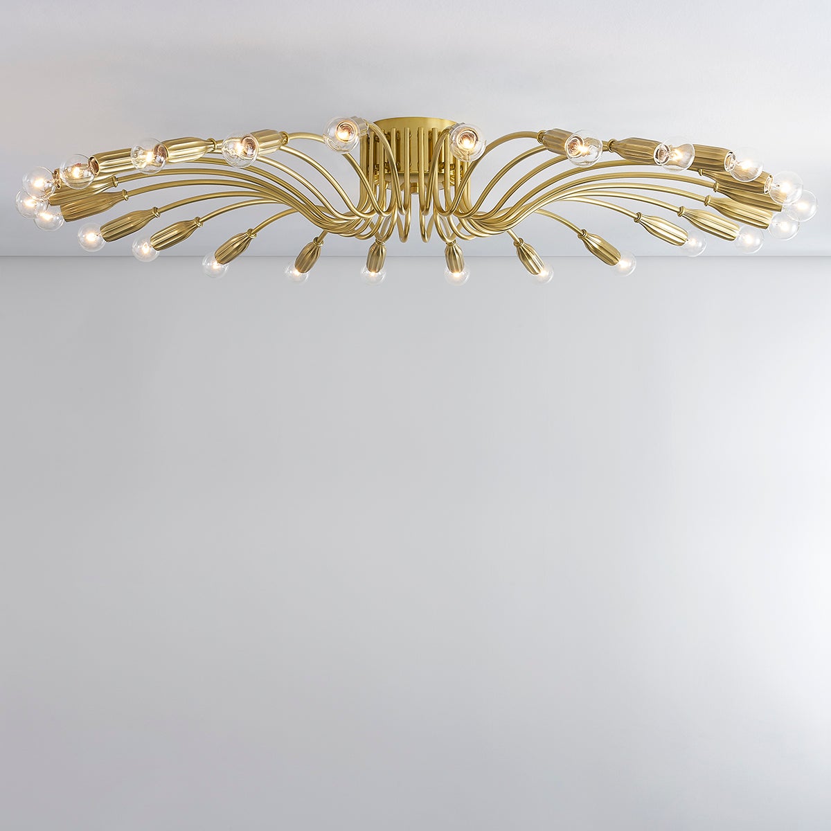 Barney Semi Flush 49.25" in aged brass shown from a second angle to highlight the shade profile and mounting canopy.