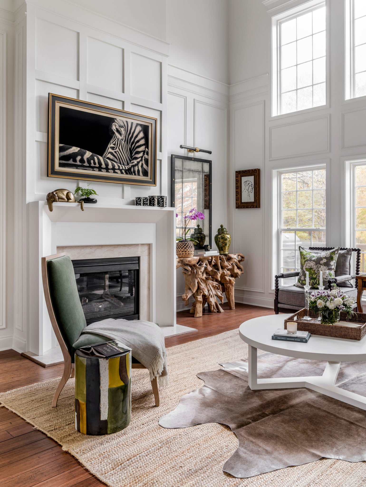 Baruch Picture Light styled in a gallery wall for warm, layered light at Laurie Yapp Home.