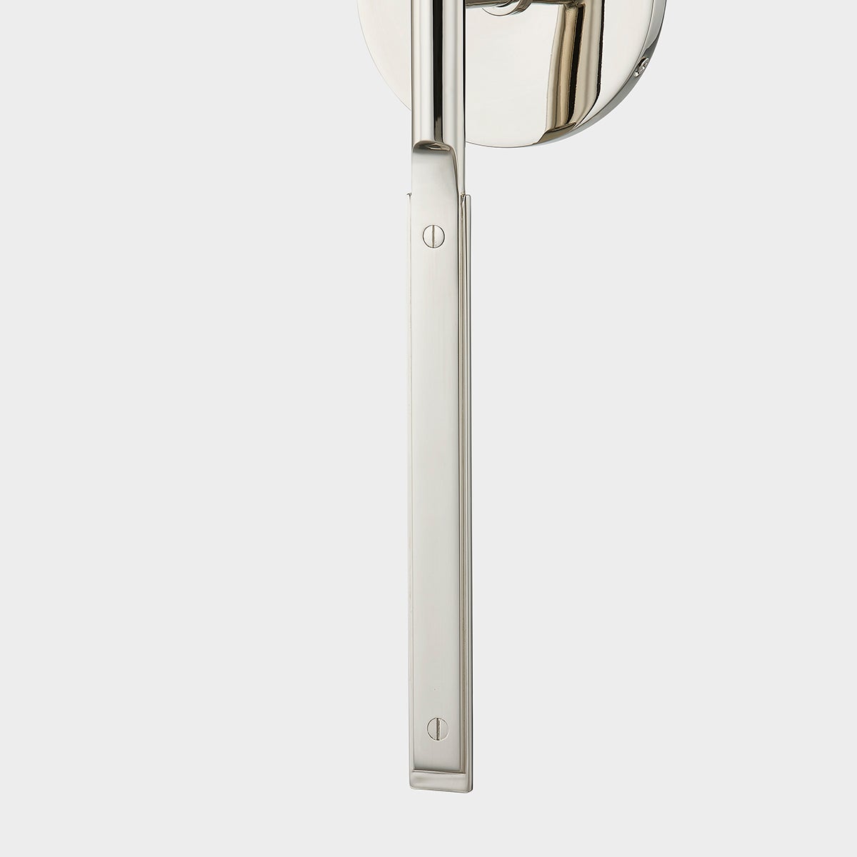 Close-up of the Brewster Wall Sconce in polished nickel showing the arm curve and shade silhouette.