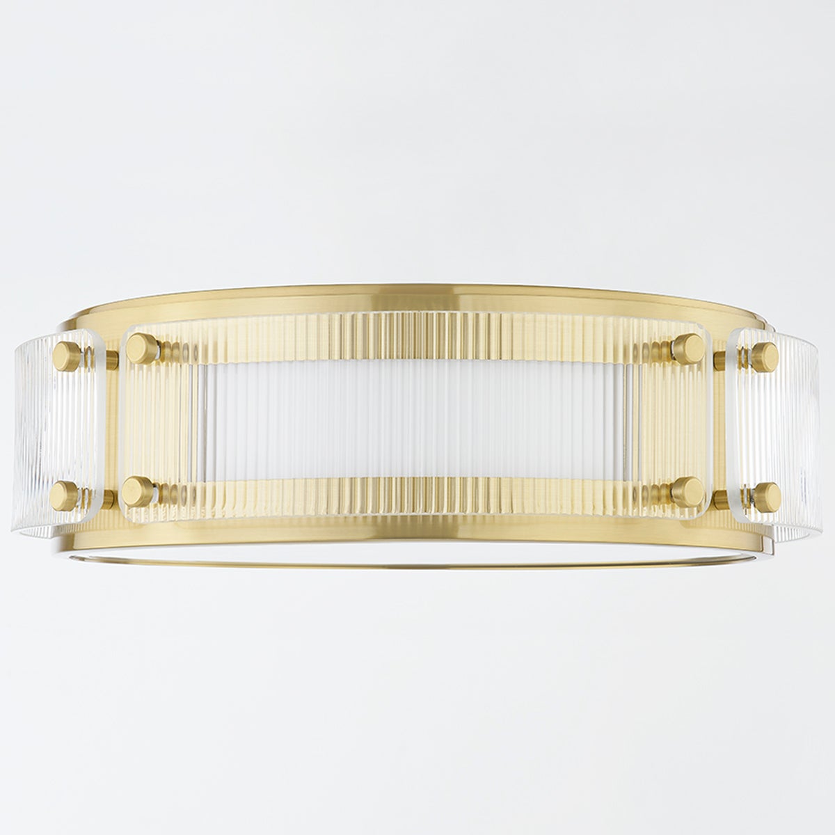 Clifford Flush Mount in aged brass shown from the front to reveal the shade profile and mounting canopy.