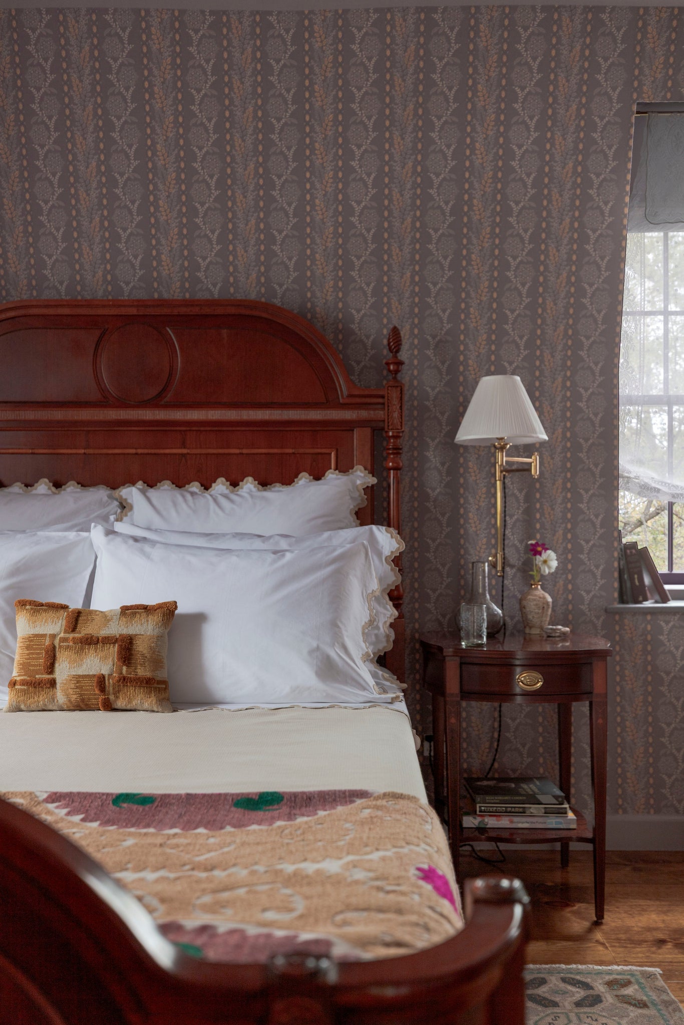 Classic No.1 Plug-In Sconce in aged brass styled in a bedroom for warm, layered light at Laurie Yapp Home.