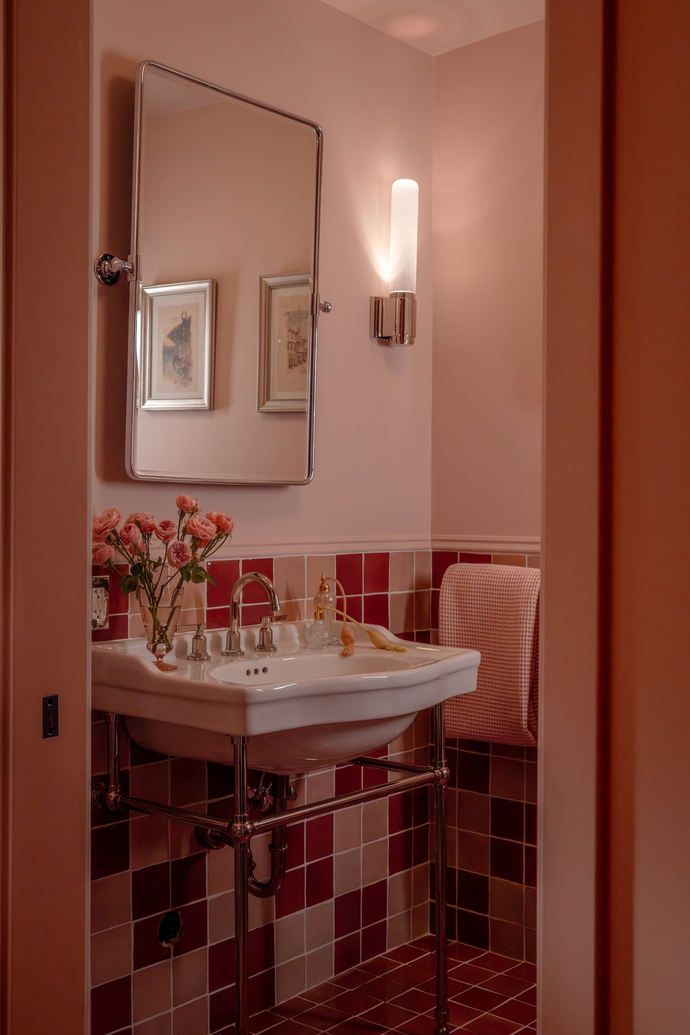 Colrain Wall Sconce 5.25" x 17.5" in polished nickel styled in a modern bathroom for warm, layered light at Laurie Yapp Home.