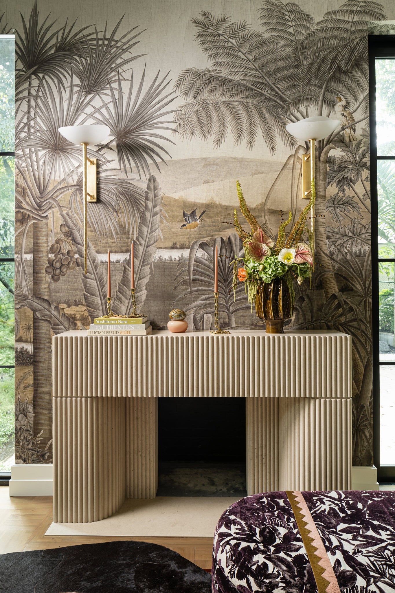 Coppa Wall Sconce styled in a modern bathroom for warm, layered light at Laurie Yapp Home.
