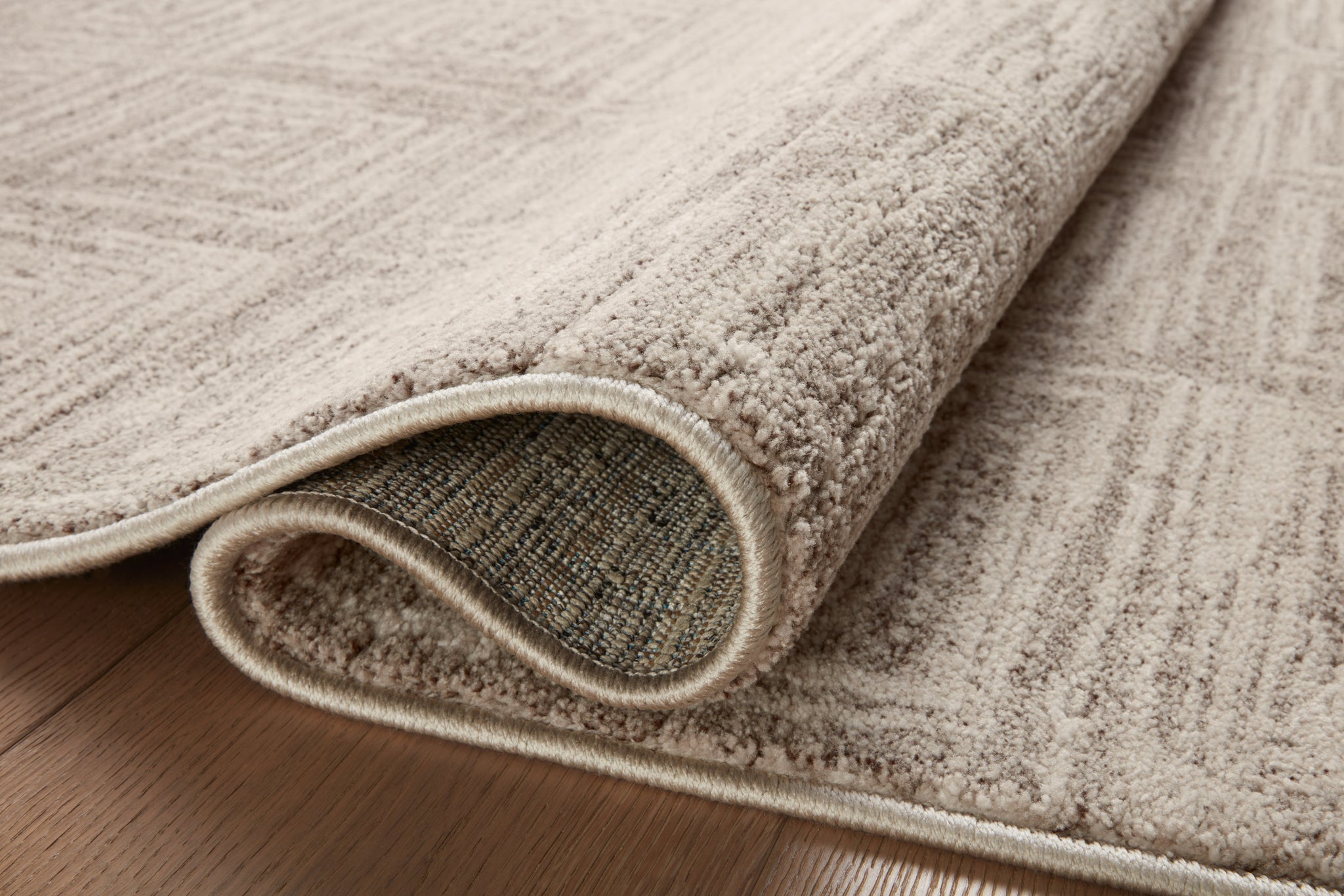 Close-up detail of the Darby Beige / Grey showing its pile and weave.