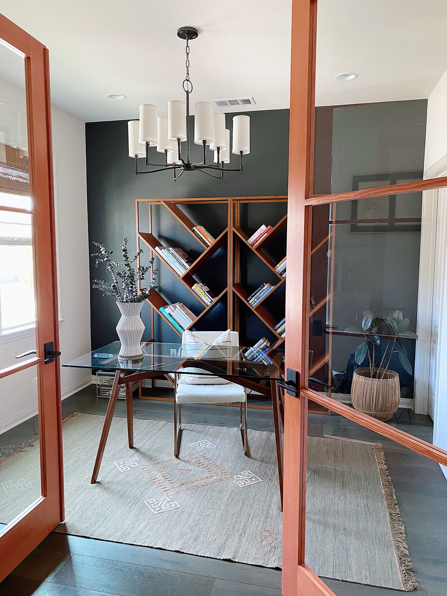 Dillon Chandelier 30" in bronze styled in a formal living room for warm, layered light at Laurie Yapp Home.