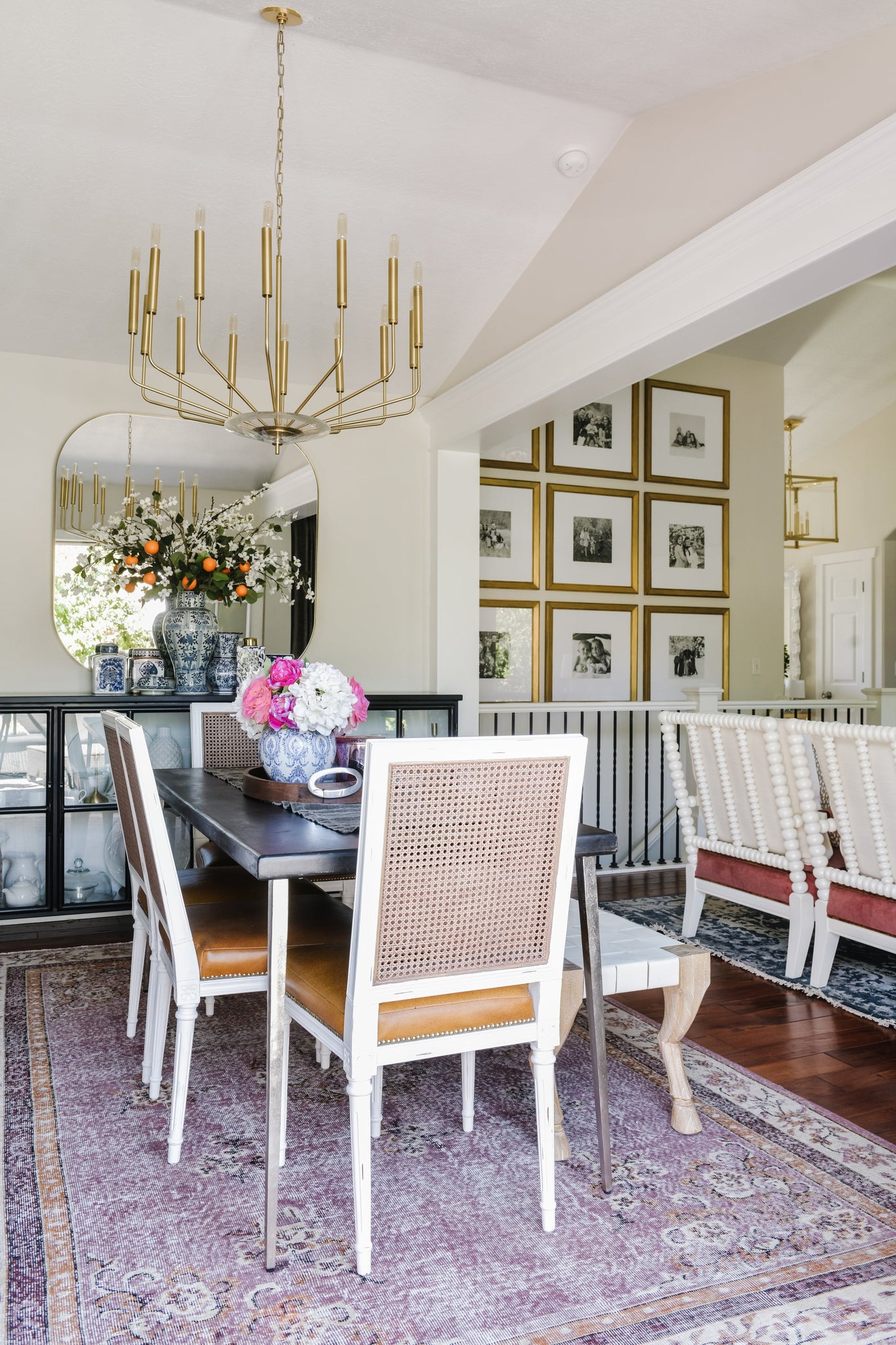 Gideon Chandelier 33.25" in aged brass styled in a two-story entry for warm, layered light at Laurie Yapp Home.