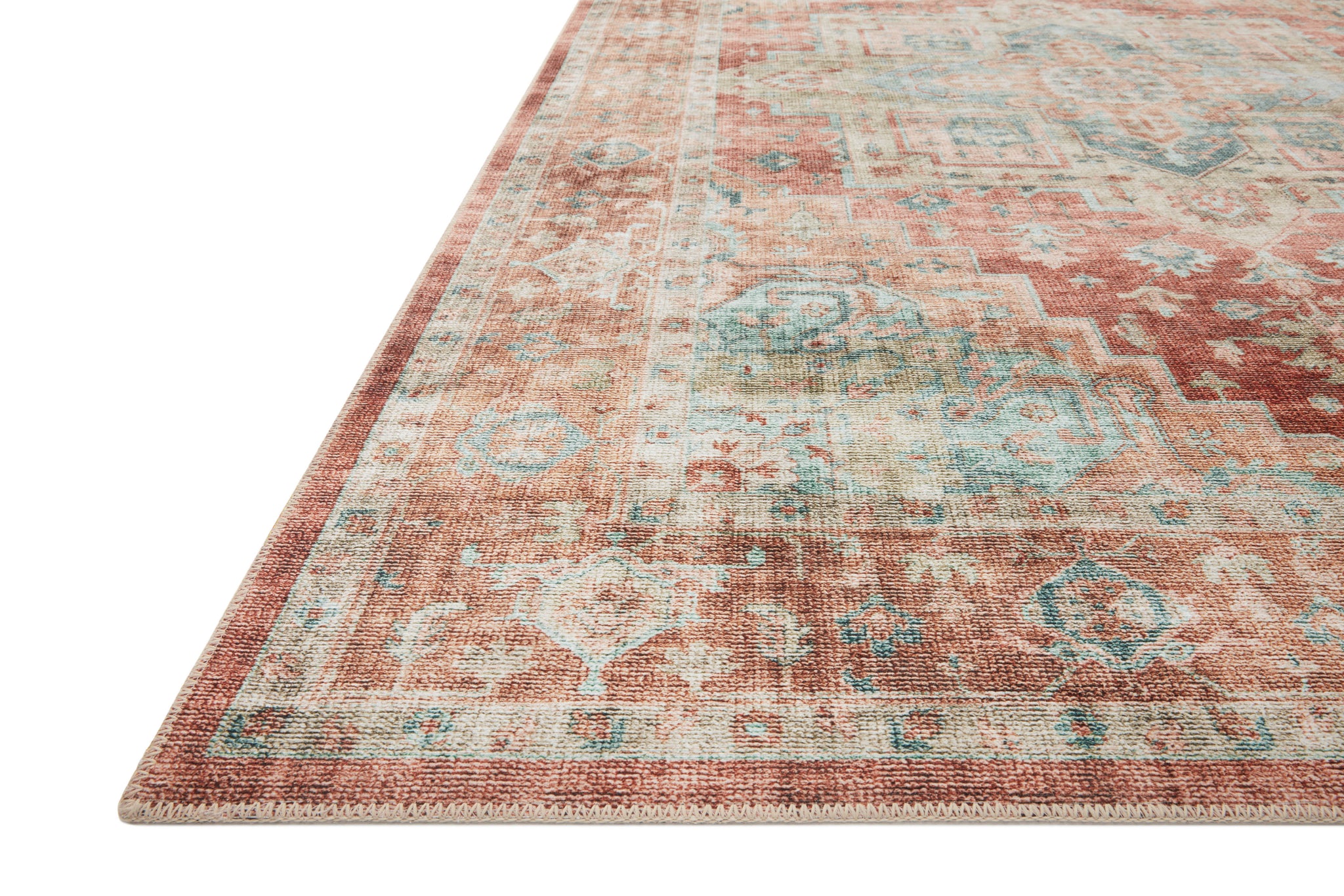 Side view of the Heidi Terracotta / Aqua rug.