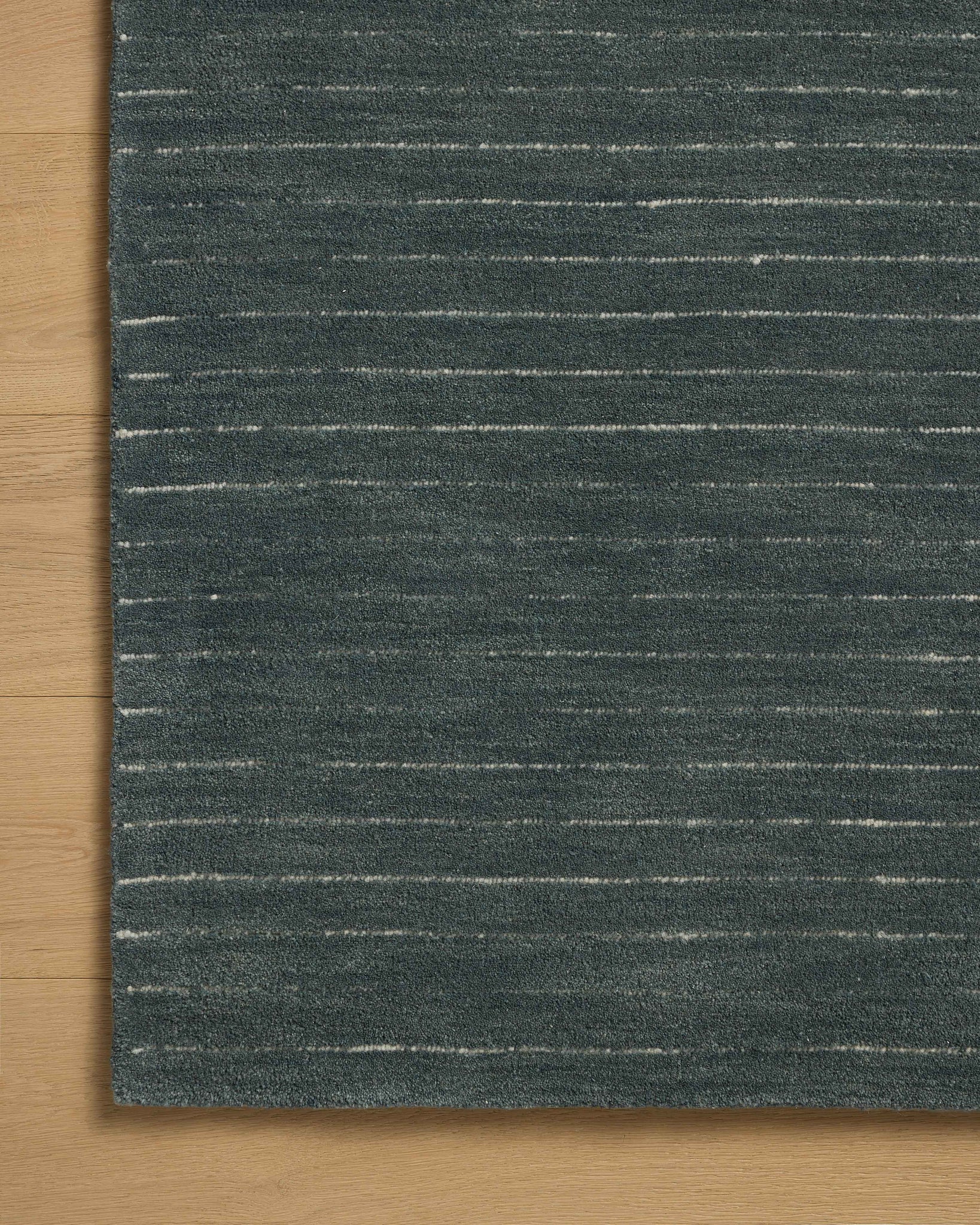 Henry Denim / Ivory shown from a different angle to reveal its pattern.