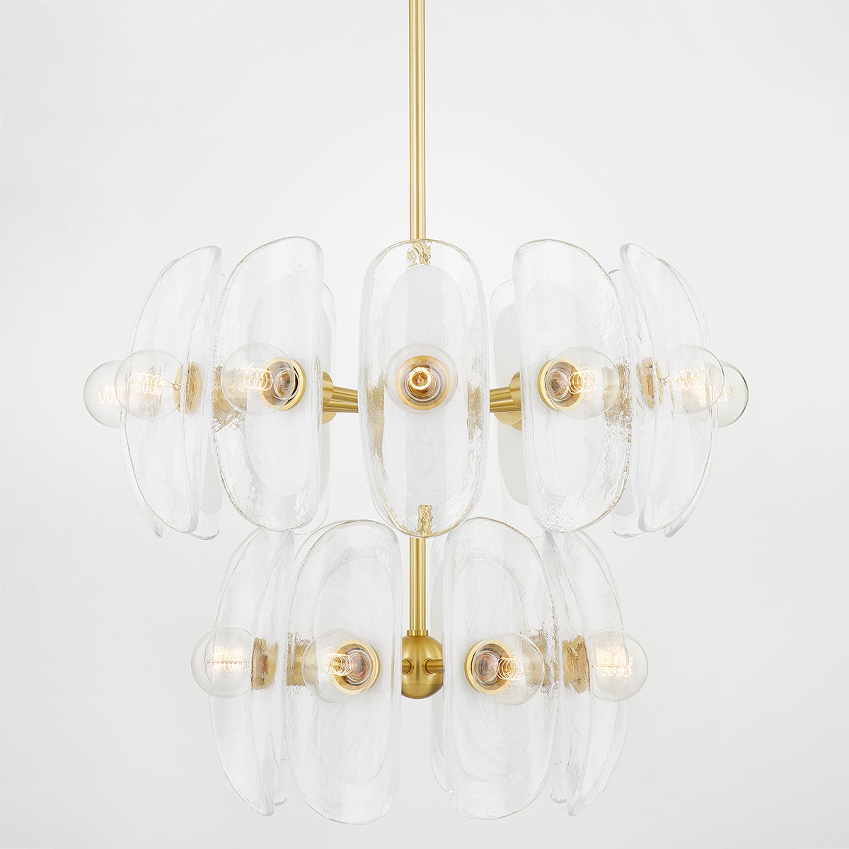 Hilo Chandelier in aged brass shown from a second angle to highlight the frame, arms, and shade detail.